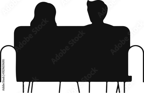 Silhouette of a couple sitting closely on a couch, facing away
