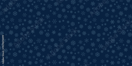 Seamless winter snowflake pattern in dark blue with light blue frosty shapes for festive design