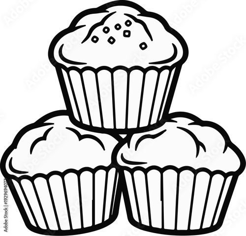 Three black and white muffins stacked in a pyramid formation