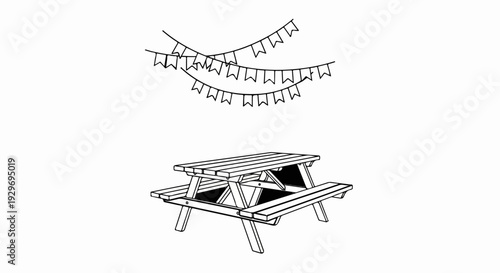 Decorative bunting hangs above a sturdy wooden picnic table, suggesting outdoor celebration