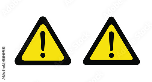 Two yellow warning signs with exclamation points a stark silhouette
