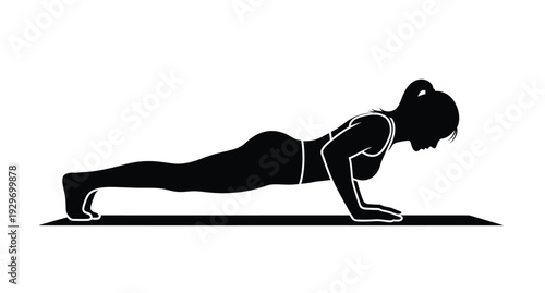 Woman performing a push up exercise in a stark black silhouette