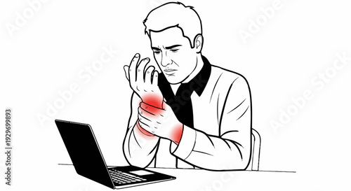 Man with wrist pain at laptop
