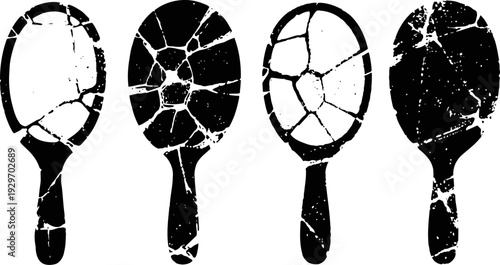 Four antique handheld mirrors with cracked and shattered glass, vintage reflections damaged accessories