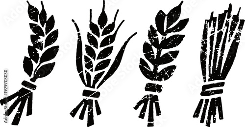 Four black wheat sheaves bunches silhouettes isolated on white background