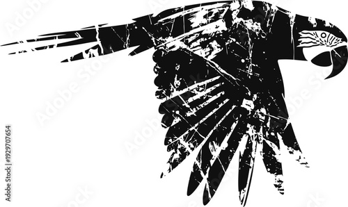 Abstract black parrot silhouette with distressed texture and spread wings in flight
