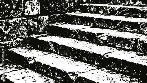 Old stone stairs with textured worn steps in black and white high contrast