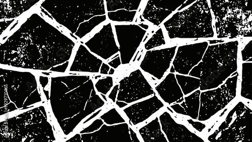 Cracked shattered glass pattern with irregular broken fragments on black background