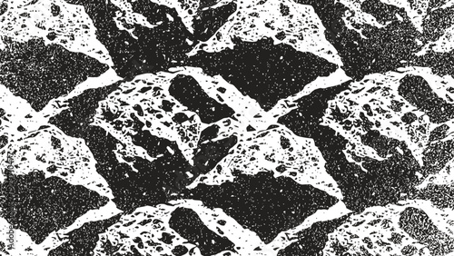 Black and white abstract rocky texture pattern with rough stone surfaces and grainy details