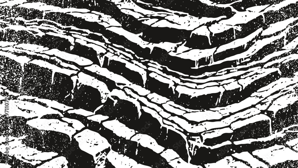 Naklejka premium Jagged rock layers with sharp edges creating natural textured terrain pattern