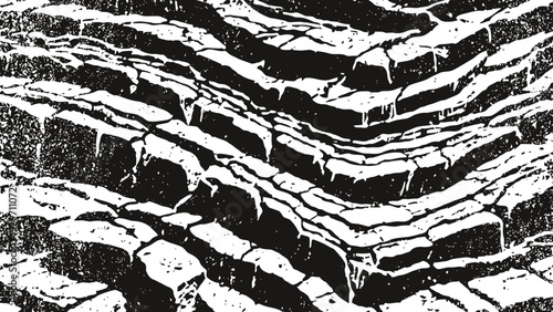 Jagged rock layers with sharp edges creating natural textured terrain pattern