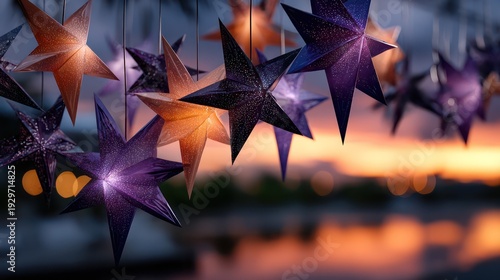 Illuminated paper stars hang against a vibrant twilight sky outdoors