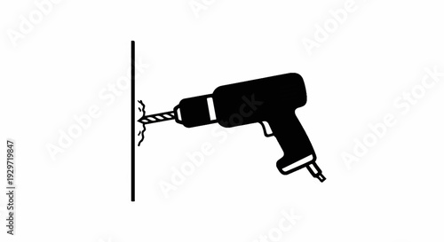 Black silhouette of a cordless drill making a hole in a wall