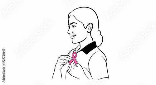 A woman smiles while holding a pink ribbon for awareness