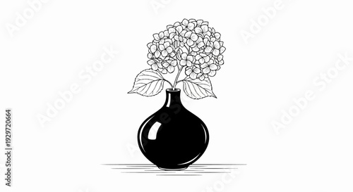 A black vase holds a delicate cluster of flowers and leaves