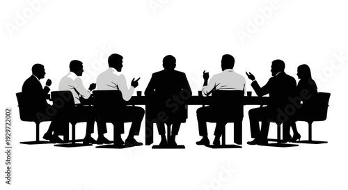 Silhouette Business Discussion: A group of individuals in silhouette engage in a focused business meeting, gathered around a large table, engaged in strategic discussion.