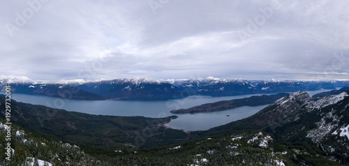 Wallpaper Mural Panoramic Snow-Capped Mountain Range Over Lake in BC Canada With Moody Winter Sky Torontodigital.ca