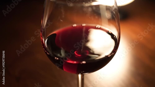 A showcasing a glass of red wine on a wooden table in a cozy atmosphere