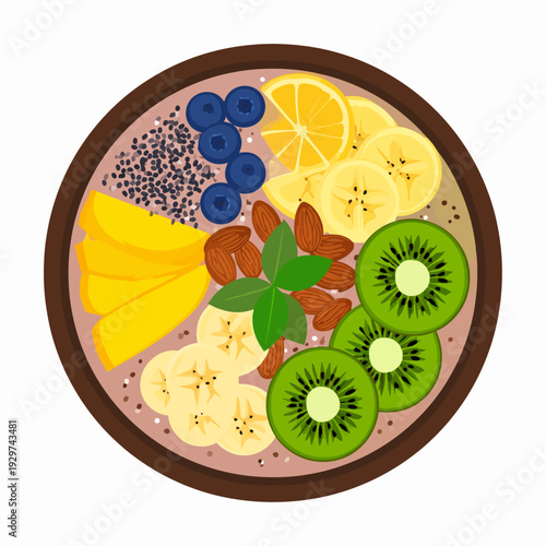 Overhead view of a vibrant fruit smoothie bowl with colorful banana, kiwi, mango, blueberry and lemon slices, brown rim, chia seeds, almonds and mint leaves on a clean white surface