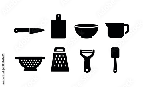 Kitchen food prep essentials: chef knife, cutting board, mixing bowl, measuring cup, colander, grater, peeler, spatula
