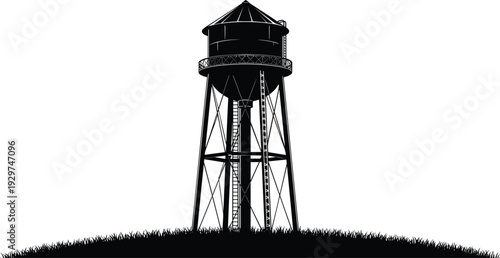 Black and white silhouette of a tall water tower on a grassy hill