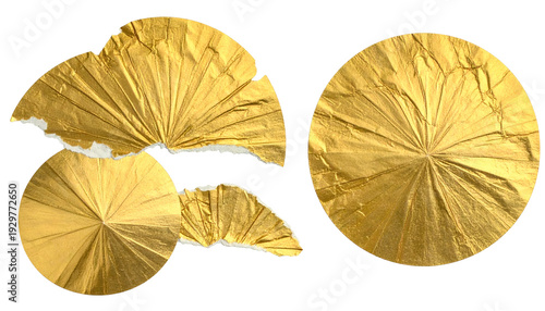 Four golden foil shapes on a black backdrop, circular and irregular