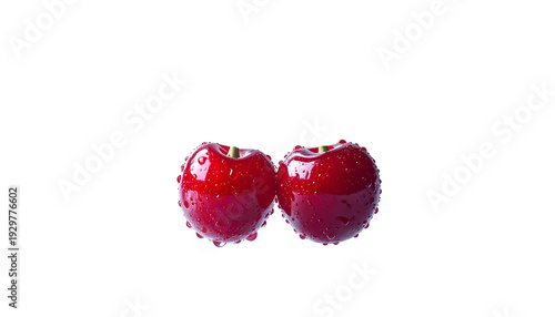 Two plump, glistening red cherries with subtle water droplets against a stark black backdrop