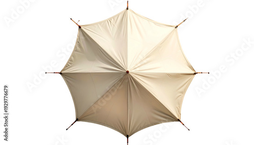 Overhead view of a tan hexagonal tent with wooden supports against a solid black backdrop