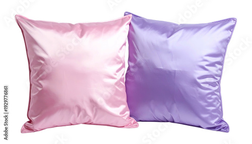 Two satin pillows, one pink and one purple, isolated on black background