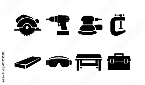 Home woodworking tools: circular saw, power drill, orbital sander, clamp, wood plank, safety goggles, workbench, tool box