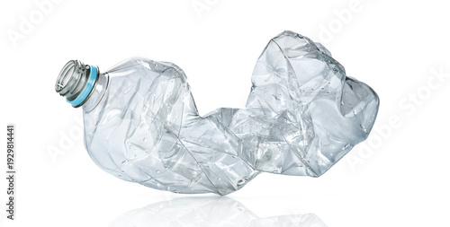 Crushed clear plastic bottle waste on white background isolated, recycling and environmental pollution concept