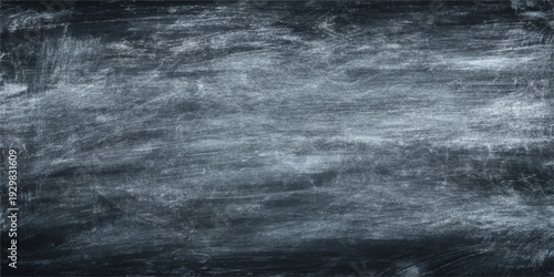 An abstract dark texture of black and white chalk on a board evokes a stormy night sky with smoke and fog over a deep ocean wave
