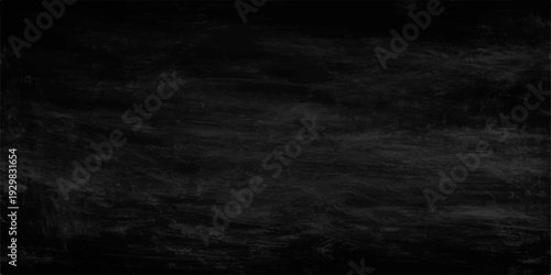 Dark abstract grunge wall background with a vintage black and white chalkboard texture featuring subtle smoke transitions and a moody storm cloud pattern
