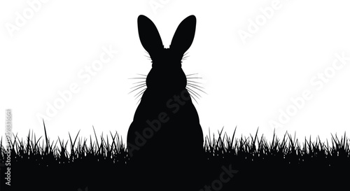 A striking black silhouette of a rabbit amidst tall grass creates a minimalist and captivating scene silhouette high quality