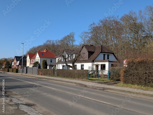 Residential Street with Houses and Blue Sky in Stralsund, Germany