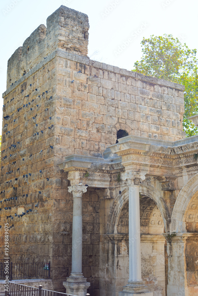Fototapeta premium Hadrian Gate, also known as the Uc Kapilar, at the entrance to Antalya Old Town or Kaleici on a sunny day