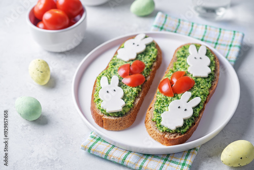 Pesto sauce mozzarella cheese in the form of rabbit rye sandwich in a plate for Easter holidays