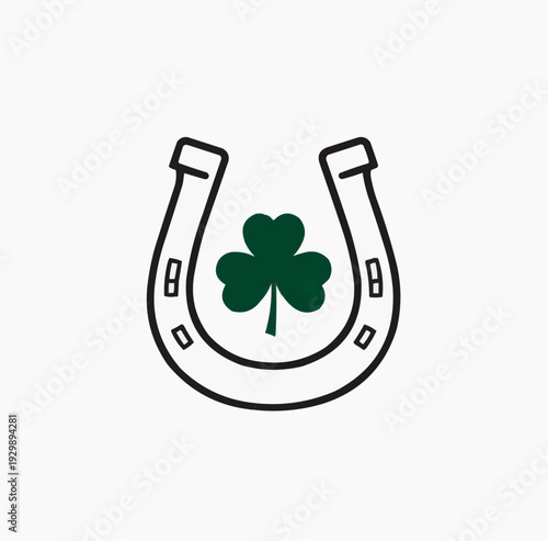 Horseshoe with a green shamrock clover for good luck and St. Patrick's Day.