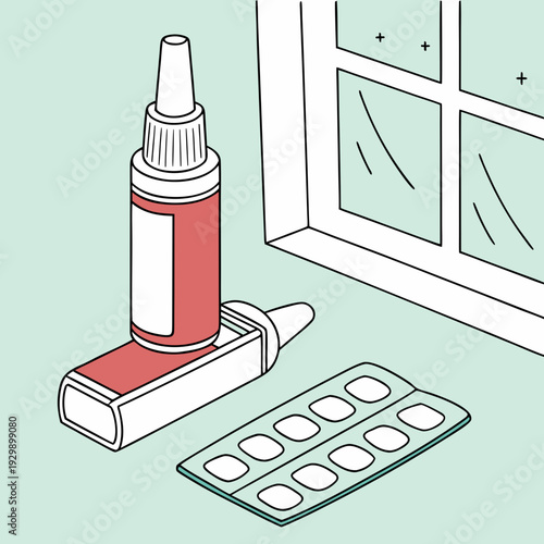 Nasal spray bottle and pill pack resting on a table near a window, illustrating health and treatment items.