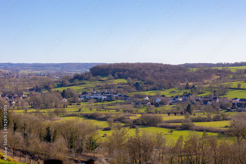 Obraz premium Winter landscape, The terrain of Schaesberg (mountain) with a small town villages on hillside, A hamlet in the Dutch province of Limburg, Municipality of Valkenburg aan de Geul and region, Netherlands