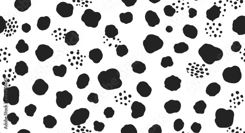 a black and white dalmatian pattern creates a trendy seamless texture perfect for modern design backgrounds or textile prints