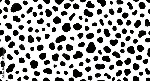 seamless dalmatian spots pattern creating a modern monochrome animal print texture on a clean white background ideal for graphic design and textile prints.