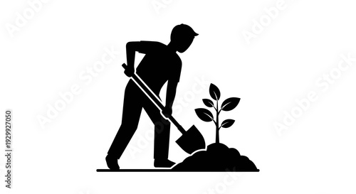 Man planting a tree with a shovel in silhouette.