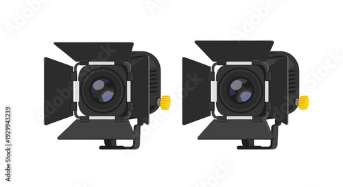 Two identical dark grey studio spotlights, each featuring adjustable barn doors and a bright yellow adjustment knob, are displayed side-by-side on a white background.