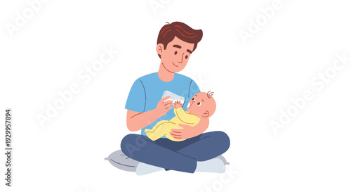 A man wearing a light blue shirt sits cross-legged on a grey cushion while bottle feeding a baby in a yellow outfit on a white background.