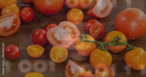 Obraz Showing red and yellow tomatoes halved and whole, resting on rustic wood table, vine, timestamp