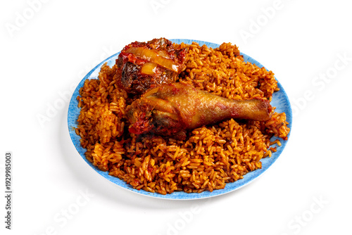 Senegal West Africa tomato and curry Jollof Rice with a roast chicken leg isolated on white