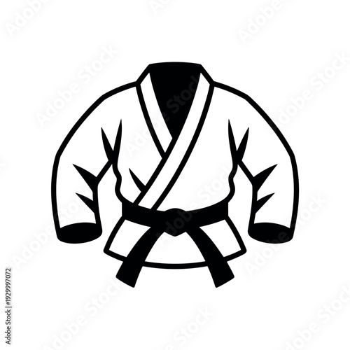 Martial arts uniform with a black belt hangs ready for an intense training session or competition.