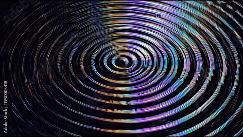 Abstract background of concentric circles with shimmering iridescent colors radiating outward from a central point, creating a mesmerizing visual effect