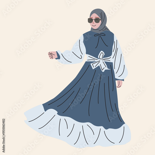 Stylish woman in a blue and white modest dress with a hijab and sunglasses.